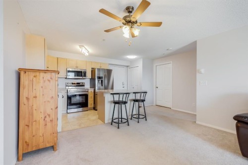 7308-304 Mackenzie Way Sw, Airdrie, AB - Indoor Photo Showing Kitchen