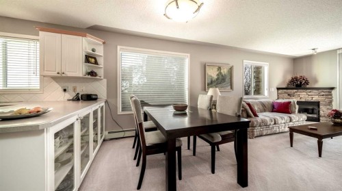 2206-7451 Springbank Boulevard Sw, Calgary, AB - Indoor With Fireplace