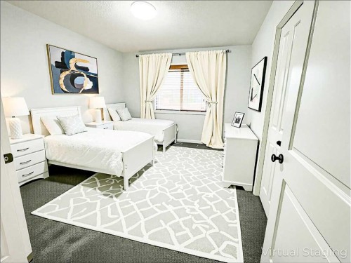 79 Tuscany Summit Bay Nw, Calgary, AB - Indoor Photo Showing Bedroom