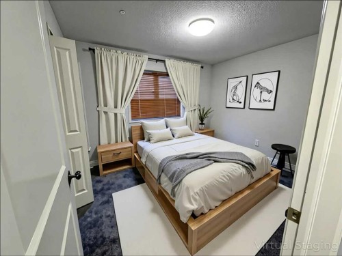 79 Tuscany Summit Bay Nw, Calgary, AB - Indoor Photo Showing Bedroom