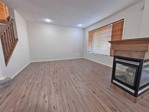 79 Tuscany Summit Bay Nw, Calgary, AB - Indoor With Fireplace