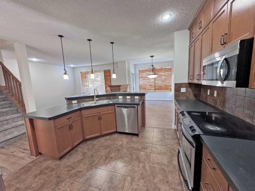 79 Tuscany Summit Bay Nw, Calgary, AB - Indoor Photo Showing Kitchen With Double Sink