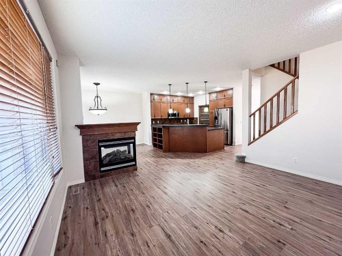 79 Tuscany Summit Bay Nw, Calgary, AB - Indoor With Fireplace