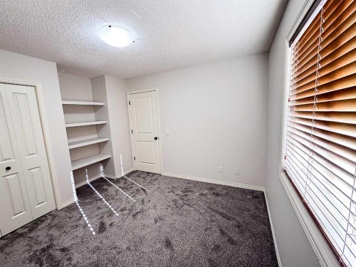 79 Tuscany Summit Bay Nw, Calgary, AB - Indoor Photo Showing Other Room