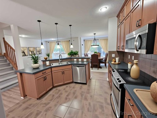 79 Tuscany Summit Bay Nw, Calgary, AB - Indoor Photo Showing Kitchen With Double Sink With Upgraded Kitchen