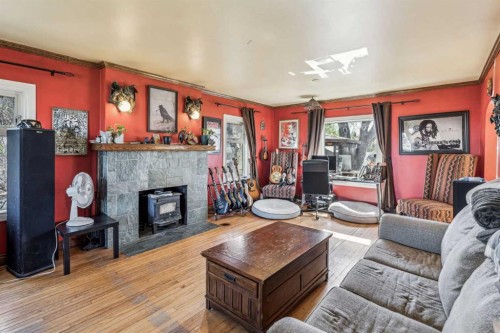 663 10 Avenue South, Carstairs, AB - Indoor Photo Showing Living Room With Fireplace