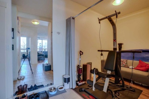 101-8710 Horton Road Sw, Calgary, AB - Indoor Photo Showing Gym Room