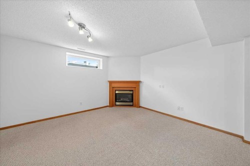 50 Citadel Ridge Green Nw, Calgary, AB - Indoor Photo Showing Other Room With Fireplace
