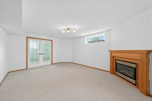 50 Citadel Ridge Green Nw, Calgary, AB - Indoor With Fireplace
