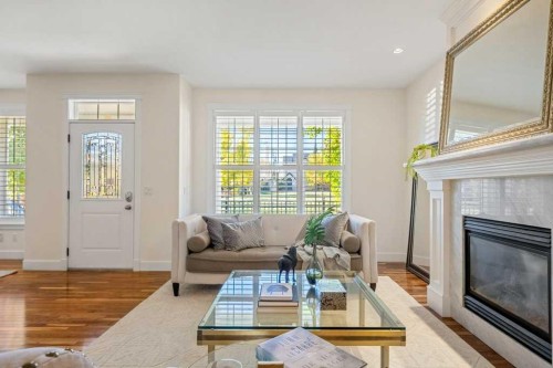 24 Ypres Mews Sw, Calgary, AB - Indoor Photo Showing Living Room With Fireplace