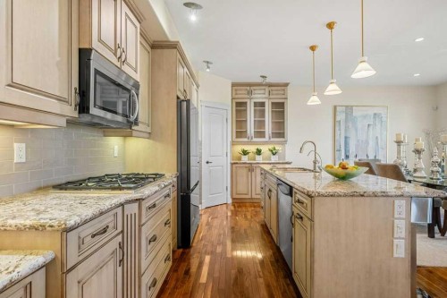 24 Ypres Mews Sw, Calgary, AB - Indoor Photo Showing Kitchen With Upgraded Kitchen