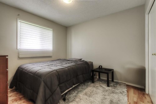 133 Hidden Spring Circle Nw, Calgary, AB - Indoor Photo Showing Bedroom