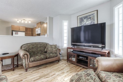 133 Hidden Spring Circle Nw, Calgary, AB - Indoor Photo Showing Living Room