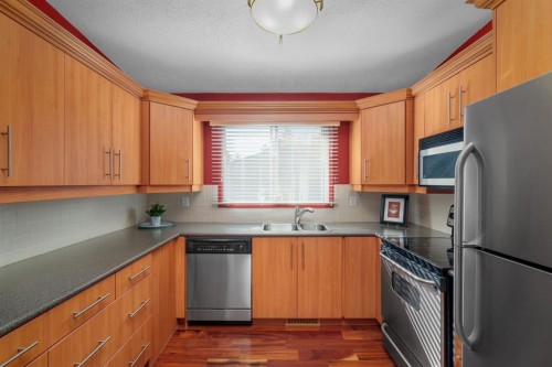 2026 41 Street Se, Calgary, AB - Indoor Photo Showing Kitchen With Double Sink