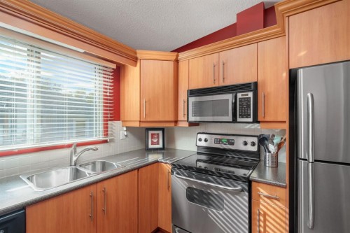 2026 41 Street Se, Calgary, AB - Indoor Photo Showing Kitchen With Double Sink