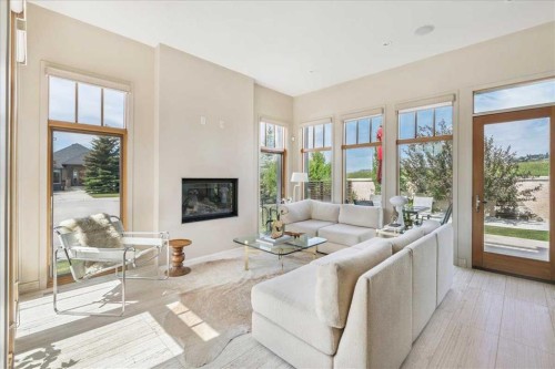374 Discovery Ridge Way Sw, Calgary, AB - Indoor Photo Showing Living Room With Fireplace