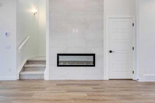 5005 Harmony Circle, Rural Rocky View County, AB - Indoor With Fireplace