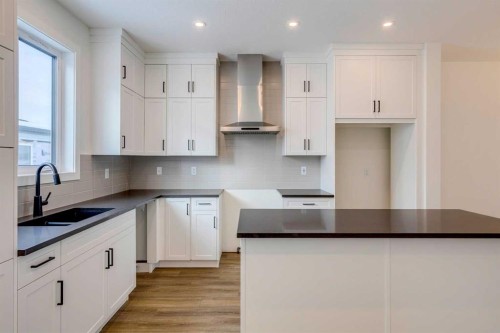 5005 Harmony Circle, Rural Rocky View County, AB - Indoor Photo Showing Kitchen With Double Sink