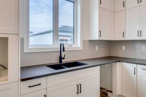 5005 Harmony Circle, Rural Rocky View County, AB - Indoor Photo Showing Kitchen With Double Sink