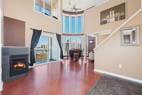 411-1540 17 Avenue Sw, Calgary, AB - Indoor Photo Showing Other Room With Fireplace