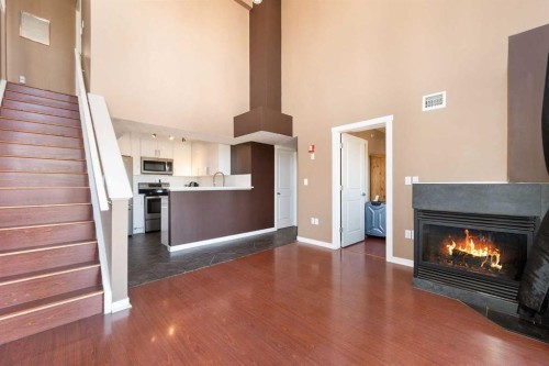 411-1540 17 Avenue Sw, Calgary, AB - Indoor Photo Showing Other Room With Fireplace