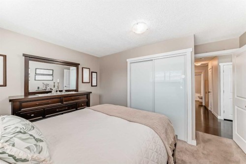67 Sandstone Crescent Se, Airdrie, AB - Indoor Photo Showing Bedroom