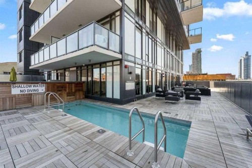 1207-1010 6 Street Sw, Calgary, AB - Outdoor With In Ground Pool With Exterior