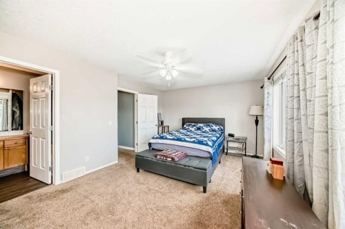 26 Copperfield View Se, Calgary, AB - Indoor Photo Showing Bedroom