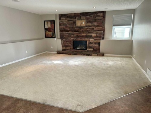 26 Copperfield View Se, Calgary, AB - Indoor Photo Showing Other Room With Fireplace