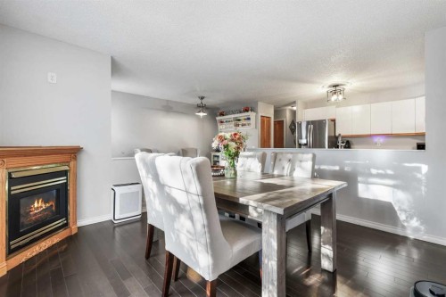 156 Martin Crossing Court Ne, Calgary, AB - Indoor Photo Showing Dining Room With Fireplace