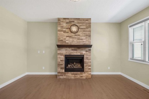140 Nolancrest Green Nw, Calgary, AB - Indoor Photo Showing Living Room With Fireplace