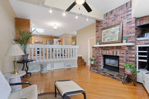 9632 Oakcliffe Drive Sw, Calgary, AB - Indoor Photo Showing Living Room With Fireplace