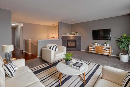 11065 Hidden Valley Drive Nw, Calgary, AB - Indoor Photo Showing Living Room With Fireplace
