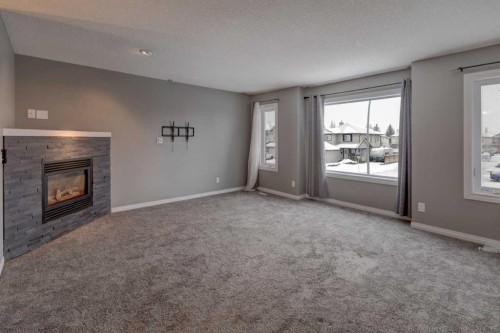 11065 Hidden Valley Drive Nw, Calgary, AB - Indoor Photo Showing Other Room With Fireplace