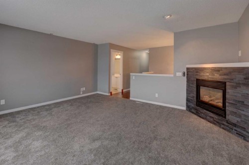 11065 Hidden Valley Drive Nw, Calgary, AB - Indoor Photo Showing Other Room With Fireplace