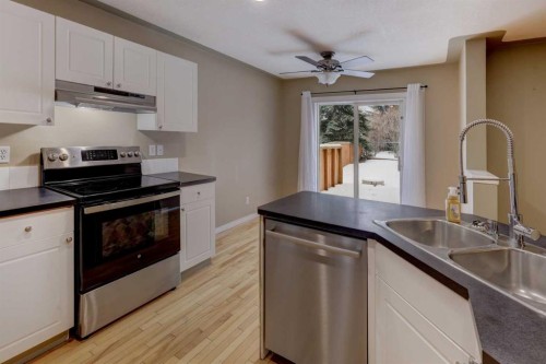 11065 Hidden Valley Drive Nw, Calgary, AB - Indoor Photo Showing Kitchen With Double Sink