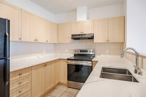 1212-333 Taravista Drive Ne, Calgary, AB - Indoor Photo Showing Kitchen With Upgraded Kitchen