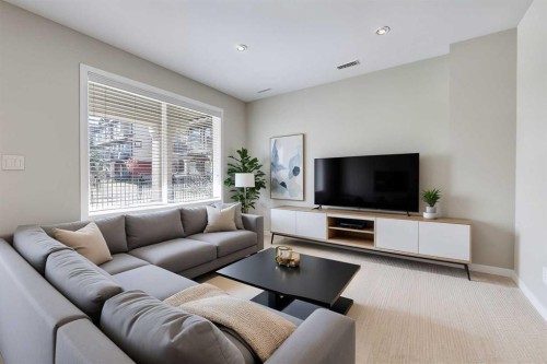 401-1086 Williamstown Boulevard Nw, Airdrie, AB - Indoor Photo Showing Living Room