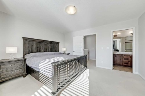 401-1086 Williamstown Boulevard Nw, Airdrie, AB - Indoor Photo Showing Bedroom