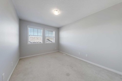 401-1086 Williamstown Boulevard Nw, Airdrie, AB - Indoor Photo Showing Other Room