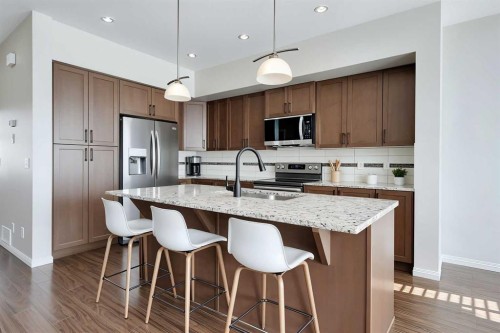 401-1086 Williamstown Boulevard Nw, Airdrie, AB - Indoor Photo Showing Kitchen With Stainless Steel Kitchen With Upgraded Kitchen