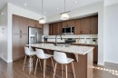 401-1086 Williamstown Boulevard Nw, Airdrie, AB  - Indoor Photo Showing Kitchen With Stainless Steel Kitchen With Upgraded Kitchen 