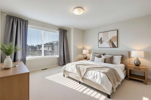 401-1086 Williamstown Boulevard Nw, Airdrie, AB - Indoor Photo Showing Bedroom