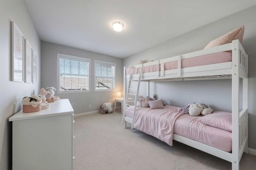 401-1086 Williamstown Boulevard Nw, Airdrie, AB - Indoor Photo Showing Bedroom