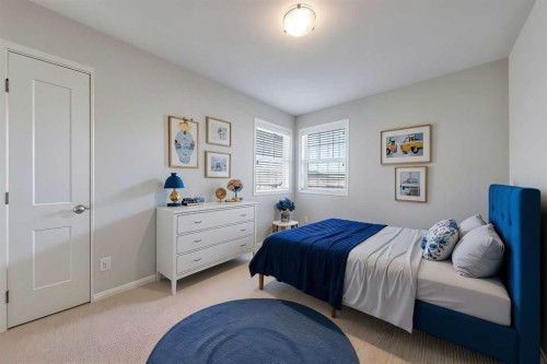 401-1086 Williamstown Boulevard Nw, Airdrie, AB - Indoor Photo Showing Bedroom