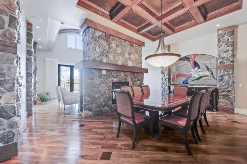 53 Spring Willow Terrace Sw, Calgary, AB - Indoor Photo Showing Dining Room With Fireplace