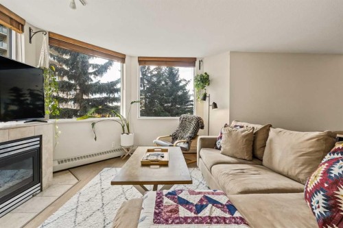 311-1108 6 Avenue Sw, Calgary, AB - Indoor Photo Showing Living Room With Fireplace