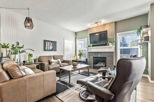 29 Cougar Ridge Close Sw, Calgary, AB - Indoor Photo Showing Living Room With Fireplace