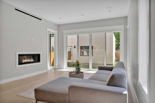 617 19 Avenue Nw, Calgary, AB - Indoor Photo Showing Living Room With Fireplace
