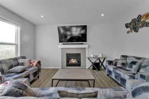 130 Red Sky Crescent Ne, Calgary, AB - Indoor Photo Showing Living Room With Fireplace